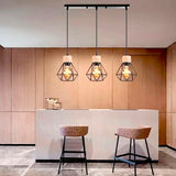 LÁMPARA COLGANTE TIPO JAULA TRIO MARINA BLACK AND WOOD + FOCO LED TIPO PERA A60 FILAMENTO TRANSP 4W 2700K LUZ CÁLIDA ILUMINA