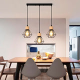 LÁMPARA COLGANTE TIPO JAULA TRIO MARINA BLACK AND WOOD + FOCO LED TIPO PERA A60 FILAMENTO TRANSP 4W 2700K LUZ CÁLIDA ILUMINA