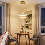Luminaria minimalista de 2 aros LED instalada sobre mesa de comedor redonda