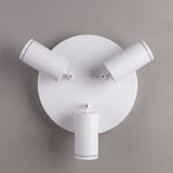 Vista cenital de tres reflectores orientables con acabados premium en pintura electrostática blanca.