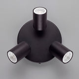 Vista cenital de tres reflectores orientables con acabados premium en pintura electrostática negra.