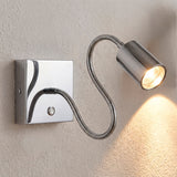 Luminaria de pared flexible en cromo con tecnología LED para iluminación técnica puntual.