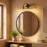 Luminaria funcional de pared combinada con elementos orgánicos y madera en baños modernos.