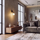 Aplique negro con foco Edison en ambiente loft industrial