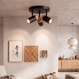Salón minimalista con cuadros iluminados por luz cenital de alta eficiencia.
