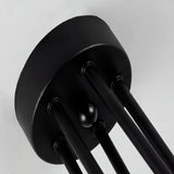 Detalle del florón cilíndrico metálico en acabado negro mate para anclaje seguro en falso techo o concreto.
