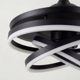 Detalle de los anillos LED entrelazados con acabado negro mate y difusor de luz suave.