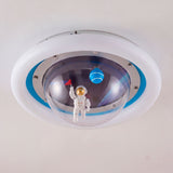 Detalle del astronauta y planetas decorativos bajo la cúpula central de la lámpara.