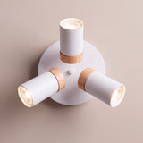 Vista superior de plafón de sobreponer con tres brazos articulados orientables en blanco mate.