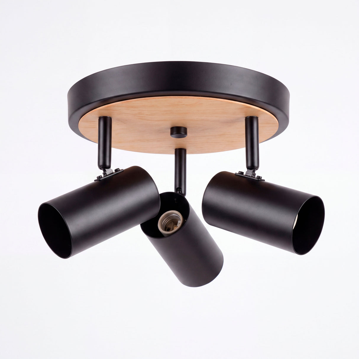 Estructura circular metálica de sobreponer con tres spots direccionables de estilo nórdico limpio.