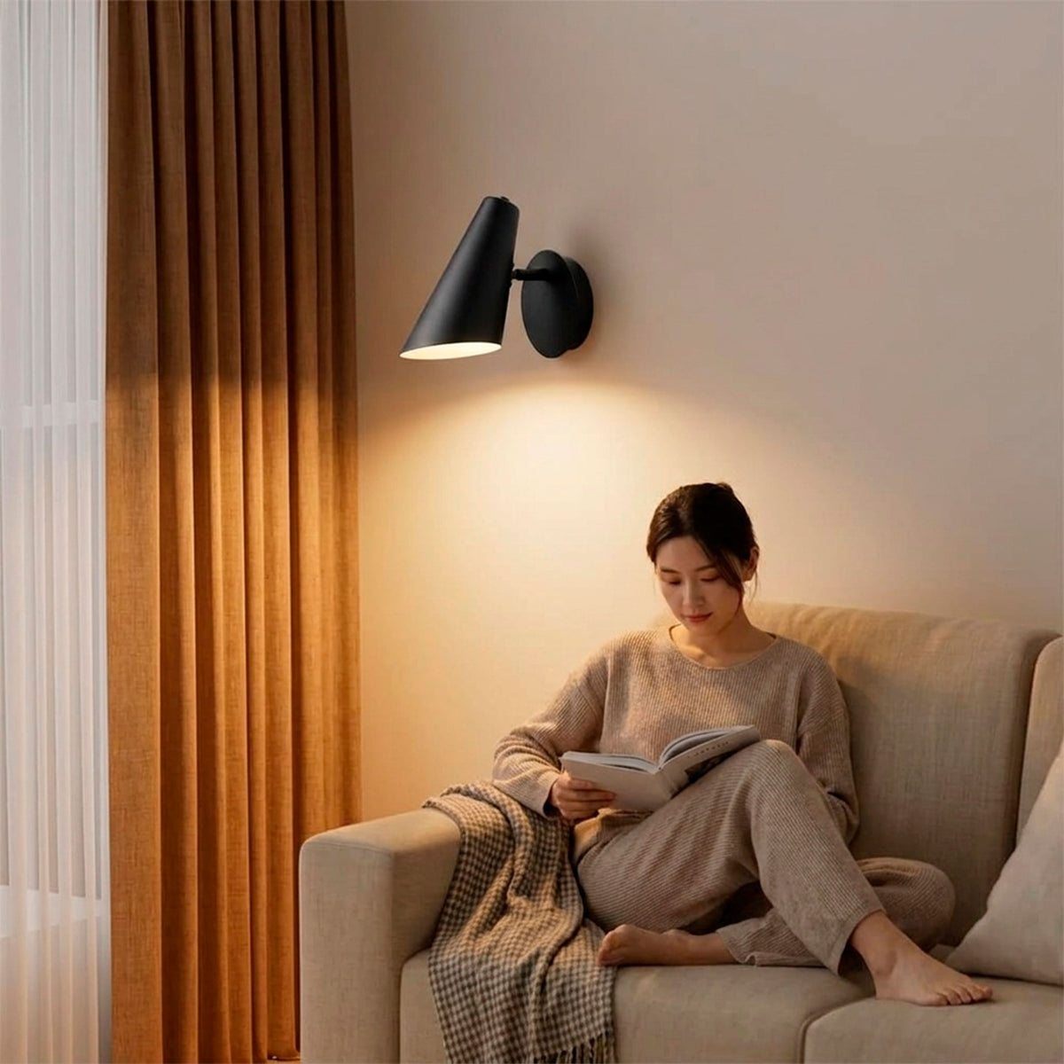 Haz luminoso directo orientable sobre rincón de lectura que favorece la ergonomía y la relajación.