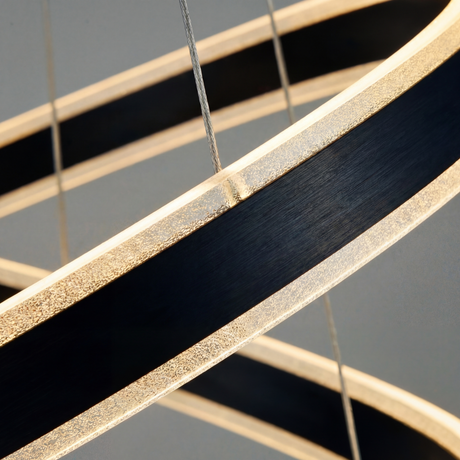 Primer plano del acabado negro con textura orgánica en aros LED circulares