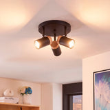 Rincón de lectura iluminado con plafón de estilo moderno y diseño minimalista.