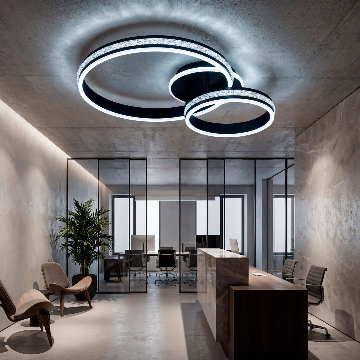 Diseño lumínico para mostradores de recepción con mamparas de vidrio y luz fría.