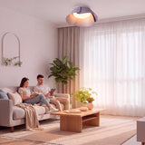Iluminación cenital sobre salón moderno para crear ambientes cálidos y de alto confort óptico.
