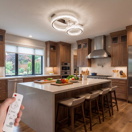 Plafón circular doble en isla de cocina con acabados en acero y luz neutra.