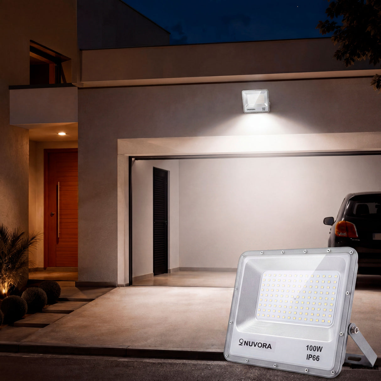 Fachada de cochera residencial iluminada con luz blanca para máxima seguridad perimetral.