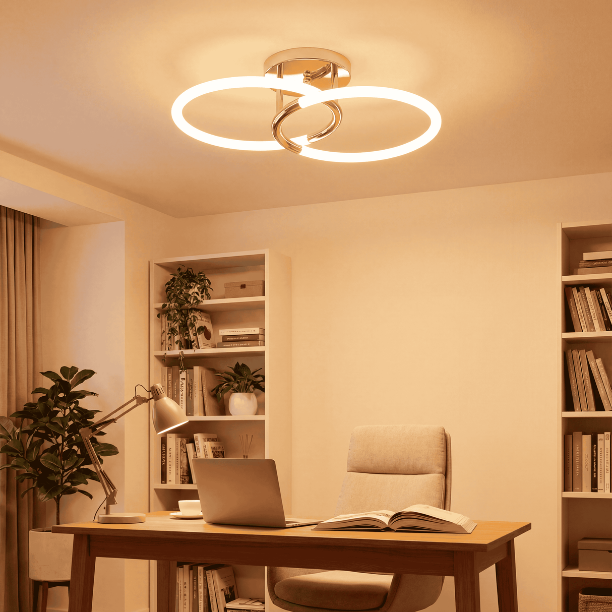 Plafón LED de doble aro dorado en zona de trabajo con luz cálida y diseño minimalista.
