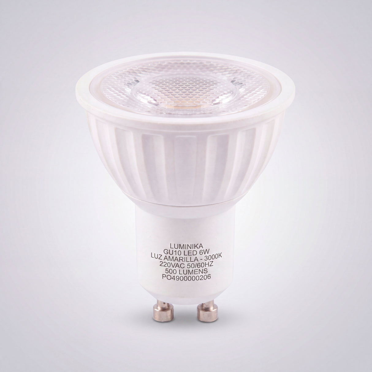 Foco de acento con cuerpo blanco y óptica difusora para proyectos de diseño minimalista.