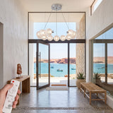 Entrada de casa moderna con vista al mar decorada con la lampara Bangle Crystal Silver.