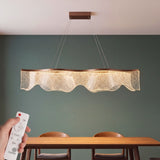 Lámpara colgante LED Ondina café encendida en luz cálida regulada con control