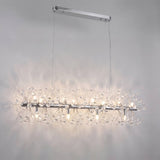 Lámpara colgante MESSIE encendida con 12 luces G9 y destellos de cristal