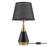 Lámpara de mesa Amira Gold negra con dorado sobre fondo blanco