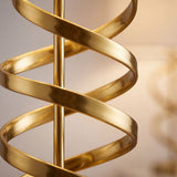 Detalle de la cinta espiral en dorado pulido alrededor de la varilla