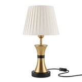 Lámpara de mesa COCO GOLD AND BLACK apagada con cable e interruptor sobre fondo blanco
