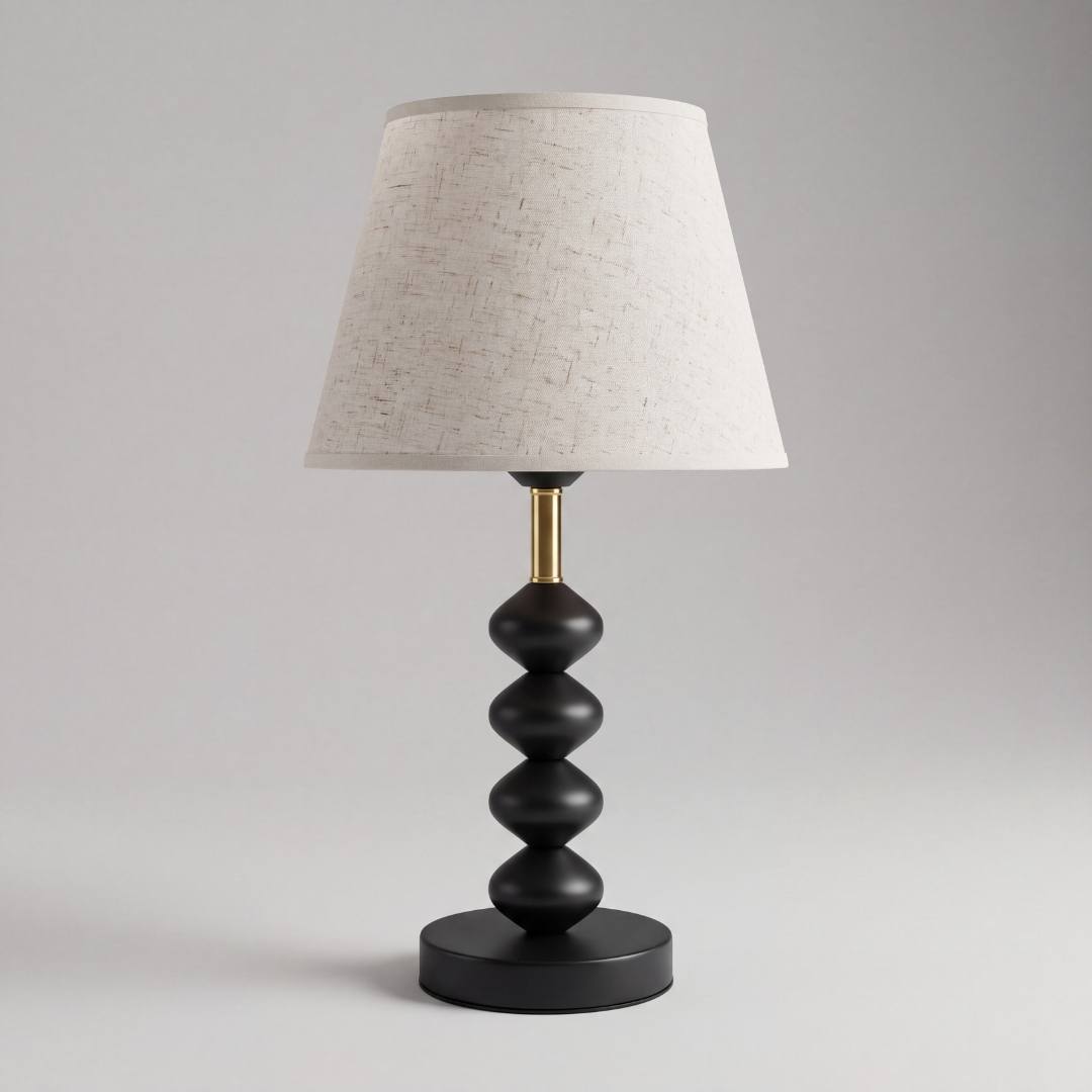 Lámpara de mesa GRETA BLACK con esferas negras sobre fondo gris neutro