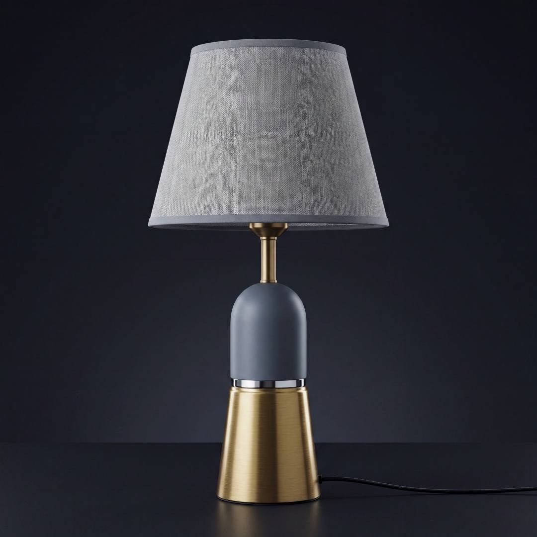 Lámpara de mesa OLIVIA GREY gris y dorada sobre fondo gris neutro