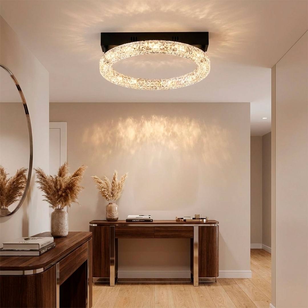 Lámpara LED de techo iluminando recibidor con consola decorativa