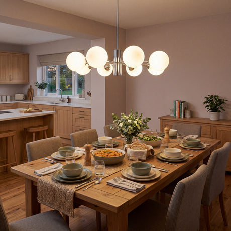 Lampara de techo cosmos silver estilo sputnik en comedor moderno con luz calida