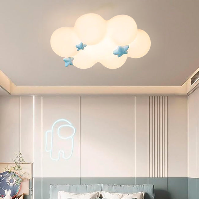 Plafón infantil en forma de nube con estrellas celestes en dormitorio moderno con neón.