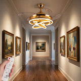 Lámpara ventilador Luxury Futura Gold instalada en un pasillo con cuadros y acabados de lujo.