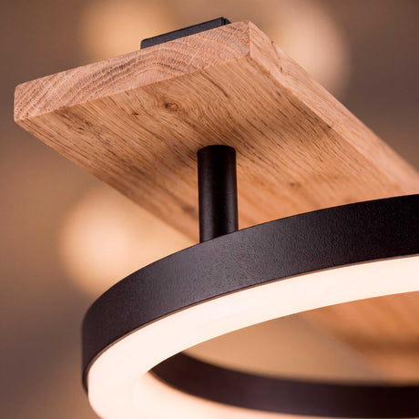 Detalle en primer plano del acabado en madera noble con chasis negro mate y difusor acrílico de alto rendimiento.
