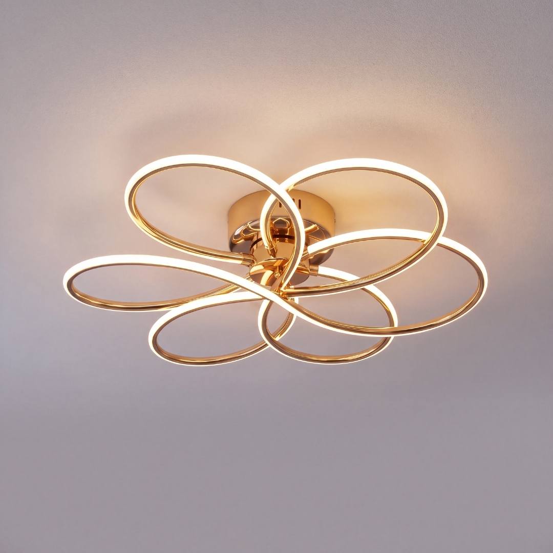 Plafón LED dorado encendido mostrando el brillo continuo de sus lazos