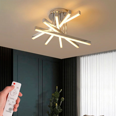 Plafón de techo con barras lineales cruzadas en acabado cromo para iluminación técnica de interiores.