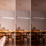 Tres niveles de brillo controlados por mando remoto en ambiente de comedor nórdico.