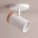 Spot adosable blanco con anillo de madera sobre fondo claro