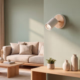 Spot dirigible blanco como aplique en sala de tonos pastel