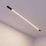 Iluminación arquitectónica lineal en sala con spot LED magnético empotrado