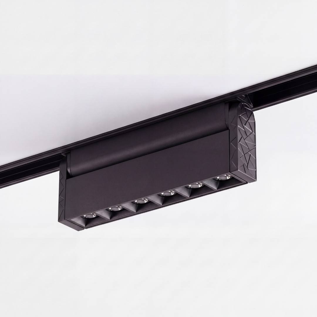 Spot LED magnético con cabezal plegado al ras del riel, perfil minimalista