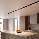 Spot LED magnético grille iluminando isla de cocina moderna