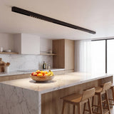 Riel magnético con spot LED grille sobre comedor de estilo moderno