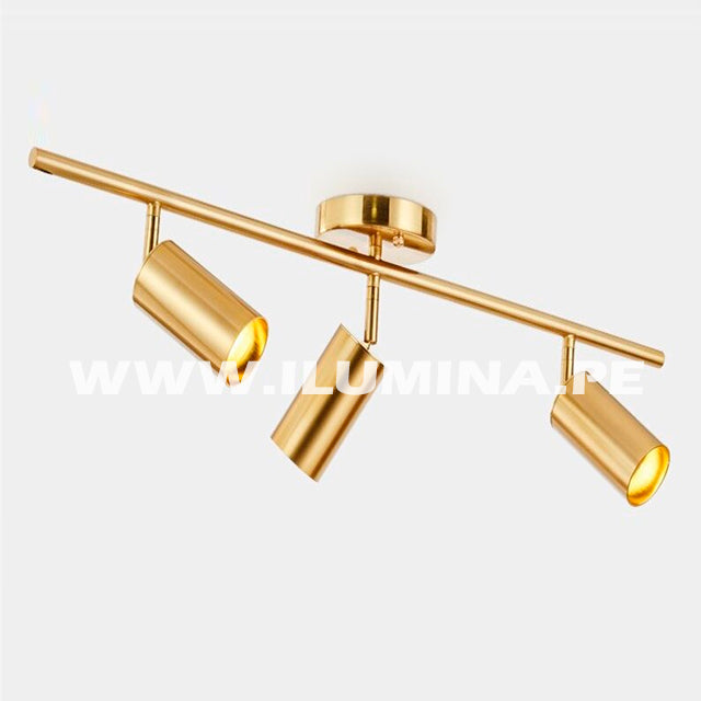 Lámpara para poner encima del espejo del baño. Lámpara de tres luces direccionables para iluminar cuadros en color dorado con sockets gu10. Venta de luminaria orientable de tres luces para dicroico LED en gu10. Lámpara de techo dirigible con cabezal orientable para luces LED. Venta de lámparas de techo en Lima en Perú.
