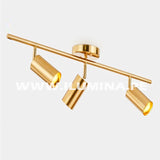 Lámpara para poner encima del espejo del baño. Lámpara de tres luces direccionables para iluminar cuadros en color dorado con sockets gu10. Venta de luminaria orientable de tres luces para dicroico LED en gu10. Lámpara de techo dirigible con cabezal orientable para luces LED. Venta de lámparas de techo en Lima en Perú.